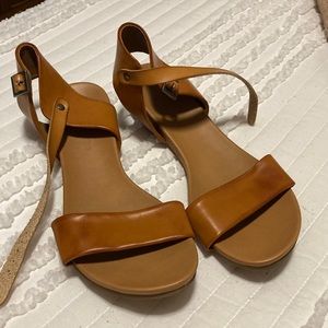 Sandals buckled at the ankle